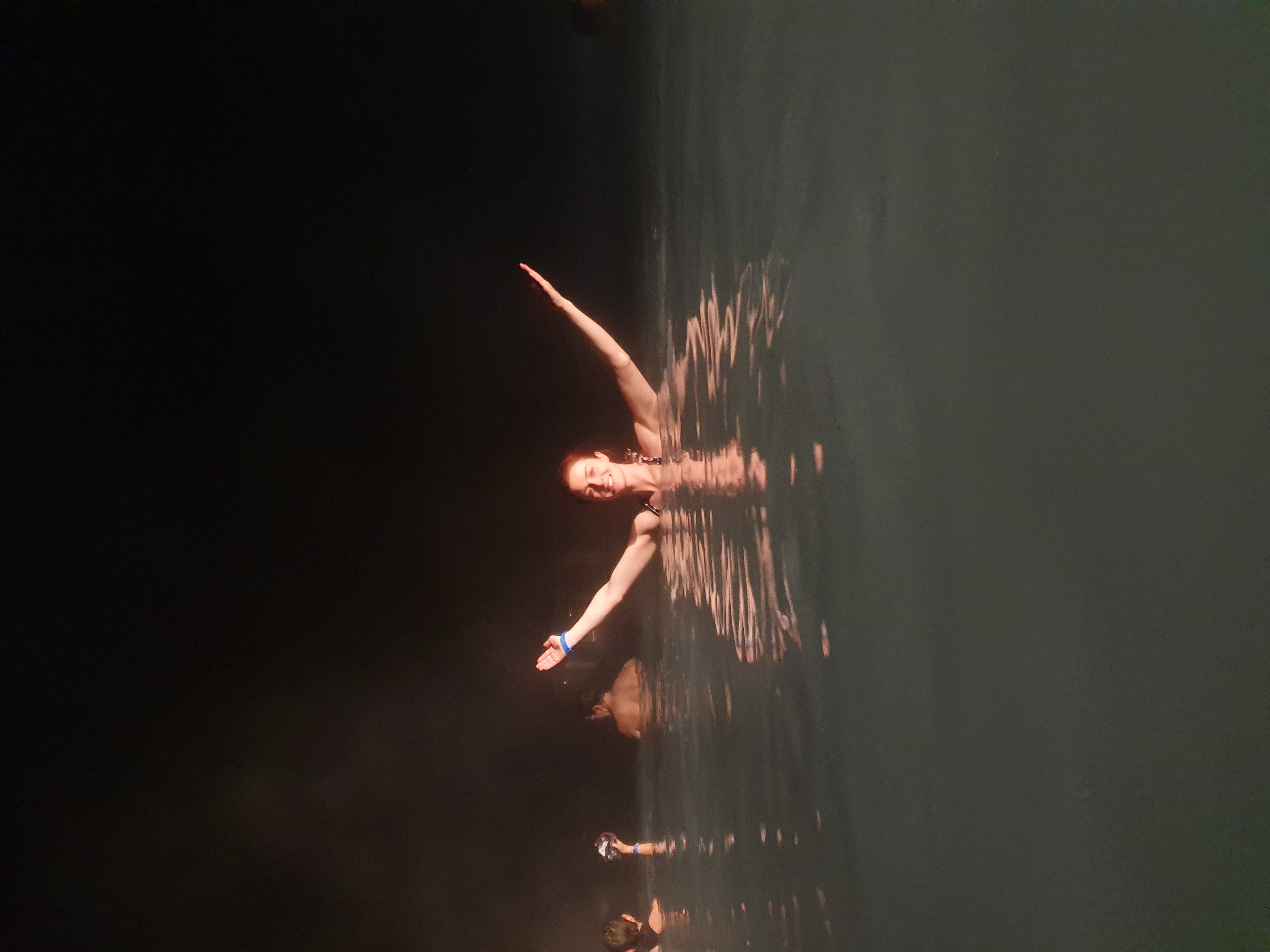 picture of me raising my hands out the water in the blue lagoon